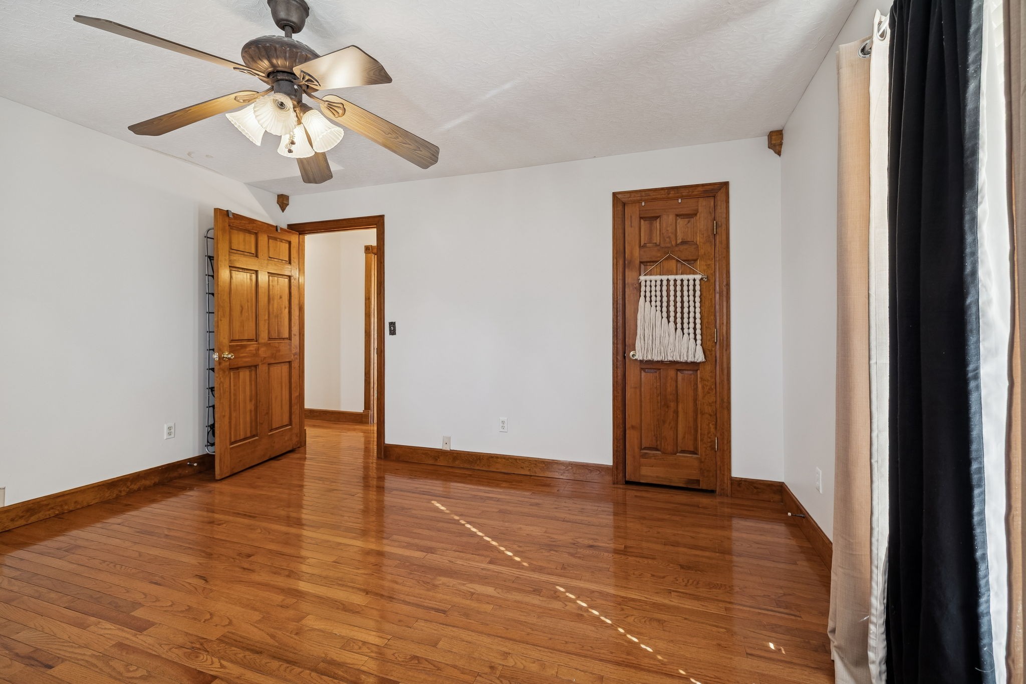 389 Trace Creek Road Red Boiling Springs, TN 37150 - Photo 34 of 57 a view of an empty room with wooden floor