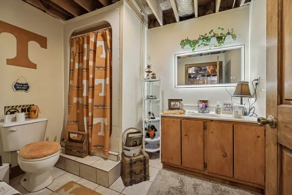 a white house that has a tree in front of it