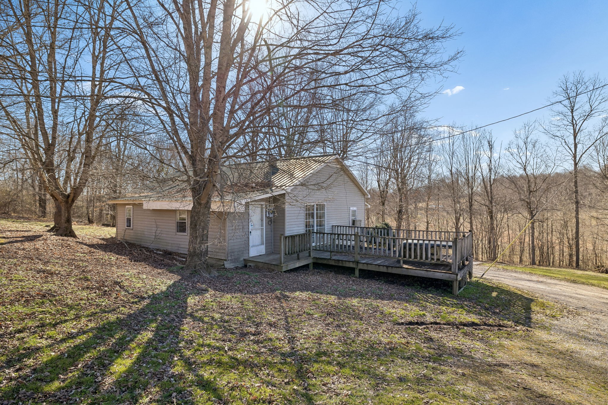 389 Trace Creek Road Red Boiling Springs, TN 37150 - Photo 56 of 57 a view of a house with a yard covered in snow