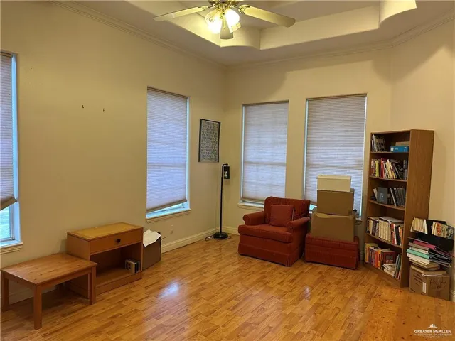 a living room with furniture and a piano