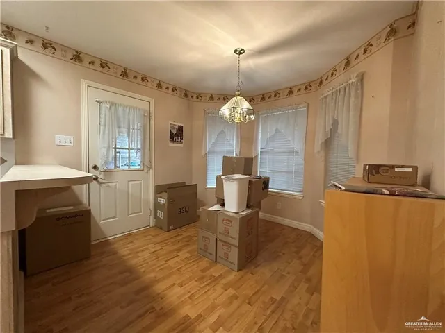 a view of a dining room with furniture and window