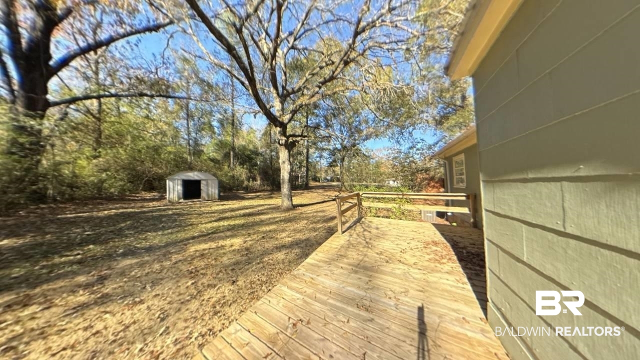 1703 Clark Avenue Bay Minette, AL 36507 - Photo 5 of 27 View of yard with a storage unit
