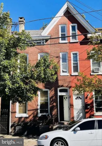 front view of a house with a street