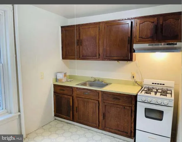 a kitchen with a stove and a sink