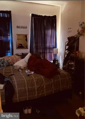 a bedroom with a bed and a closet