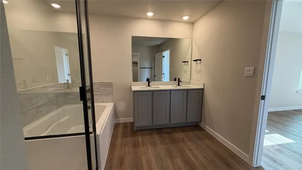 a view of a bathroom from a hallway