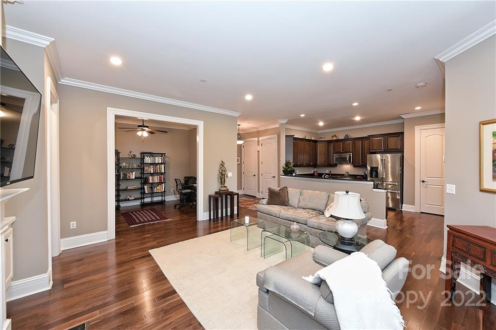 3240 Park Road Charlotte, NC 28209 - Photo 15 of 39 a living room with furniture kitchen view and a wooden floor