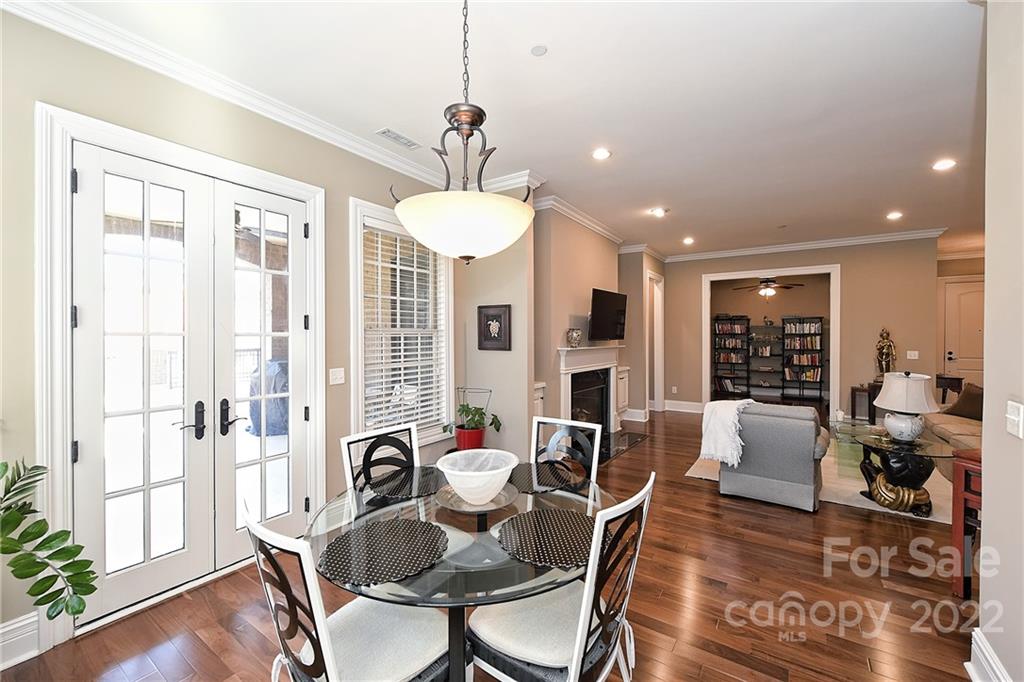 3240 Park Road Charlotte, NC 28209 - Photo 18 of 39 a view of a dining room with furniture window and wooden floor