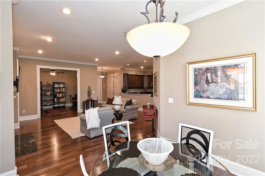 3240 Park Road Charlotte, NC 28209 - Photo 21 of 39 a living room with furniture a flat screen tv and kitchen view