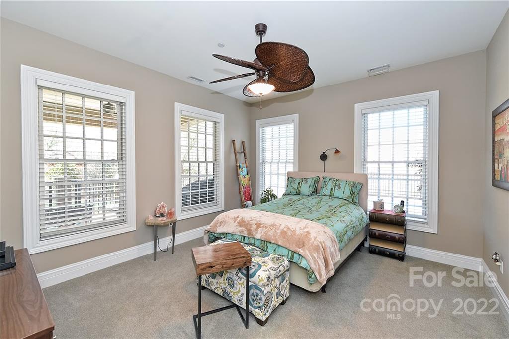 3240 Park Road Charlotte, NC 28209 - Photo 22 of 39 a bedroom with a large bed and a large window