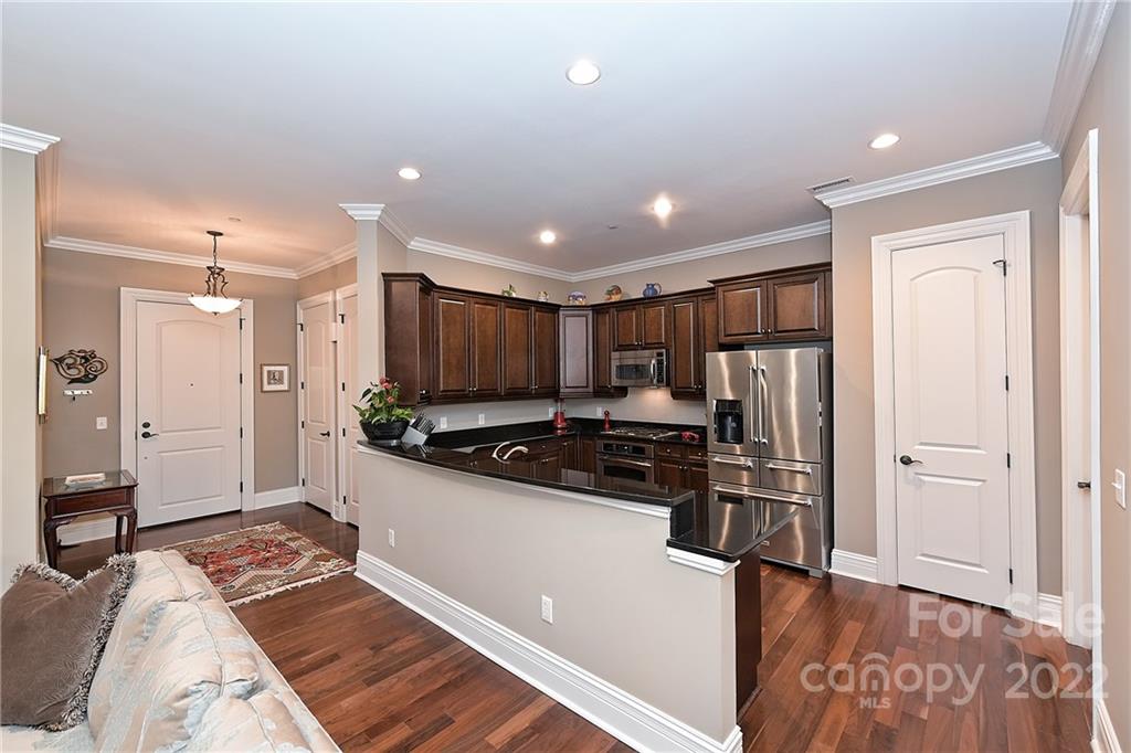 3240 Park Road Charlotte, NC 28209 - Photo 8 of 39 a kitchen with stainless steel appliances a refrigerator and a stove top oven