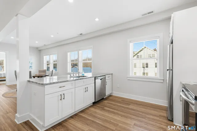 a kitchen with sink and cabinets