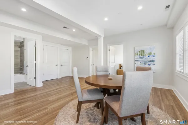 a view of a dining room with furniture and wooden floor
