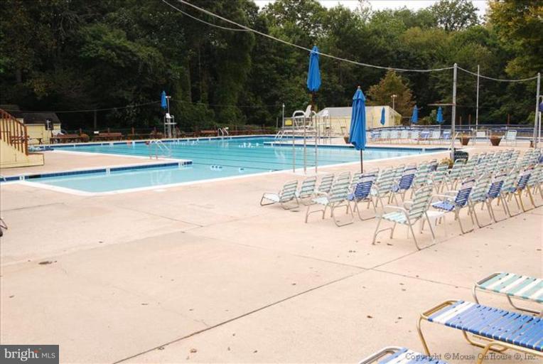 5419 Moultrie Road Springfield, VA 22151 - Photo 14 of 17 a view of a swimming pool with a patio