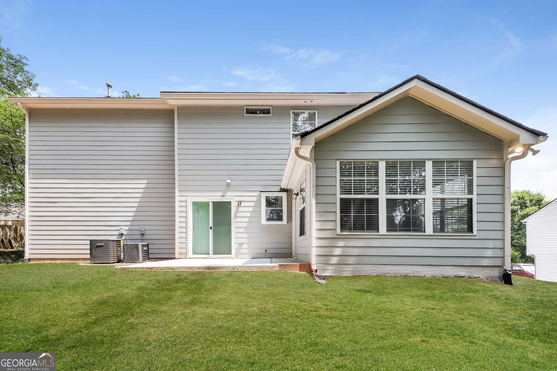 9945 Rivercliff Lane Villa Rica, GA 30180 - Photo 15 of 17 a view of a house with a yard