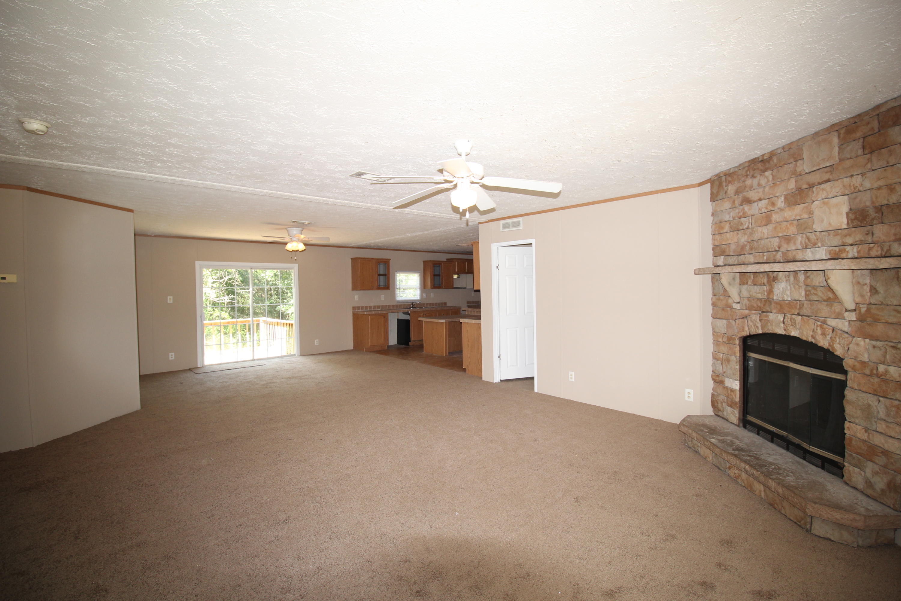 3935 Bambi Road Crestview, FL 32539 - Photo 2 of 21 a view of empty room with a fireplace and entryway