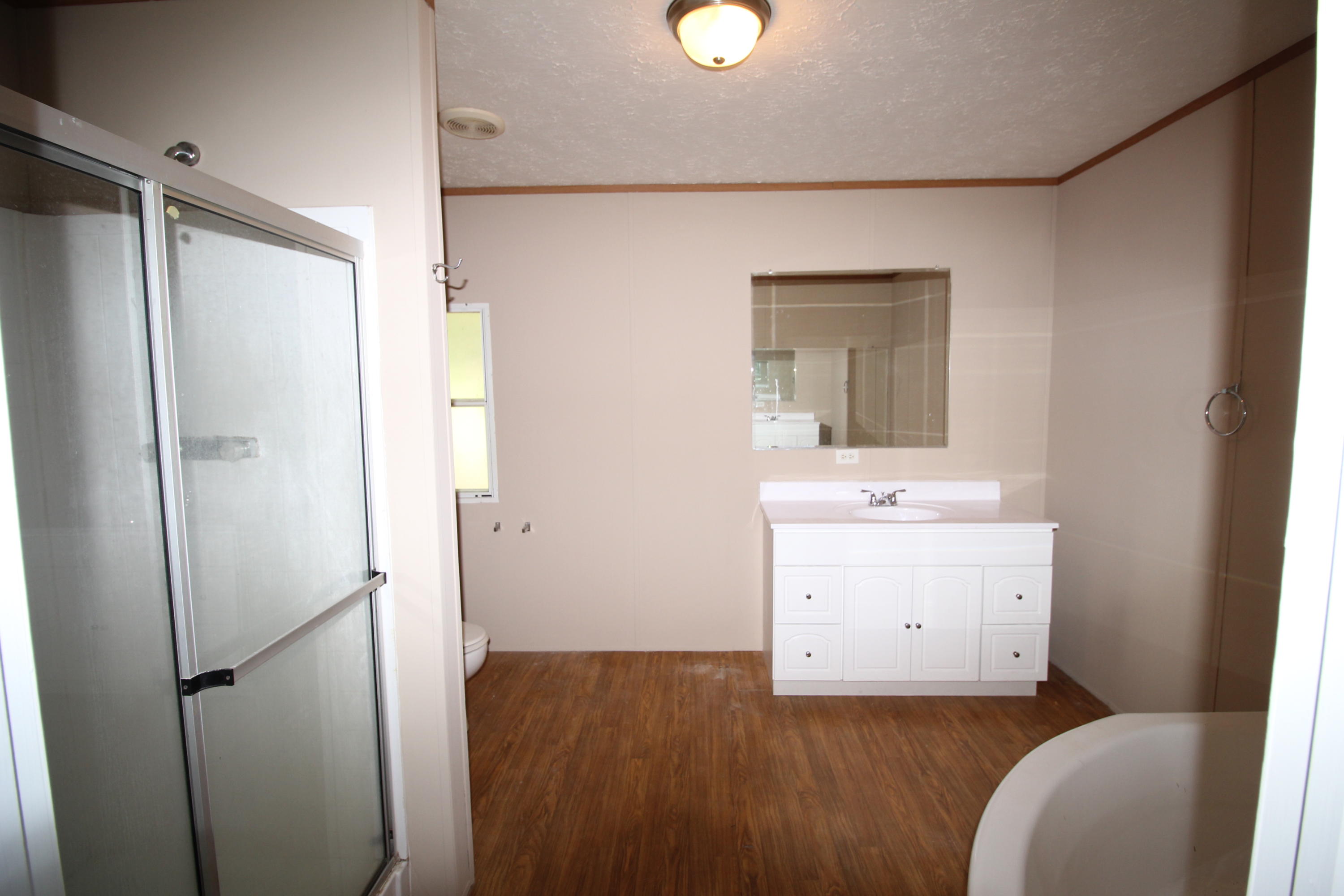 3935 Bambi Road Crestview, FL 32539 - Photo 8 of 21 a bathroom with a sink a mirror and a toilet