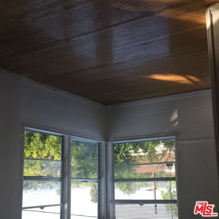 a view of a room that has a large window