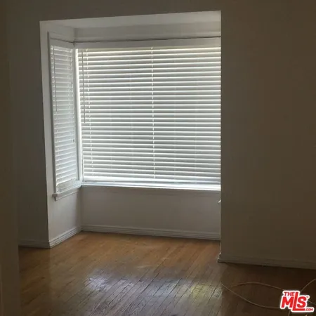 a view of a room that has a window in it