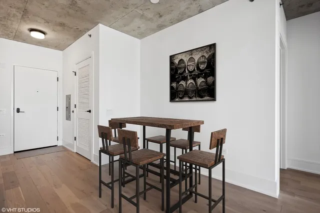 a view of a dining room with furniture and wooden floor