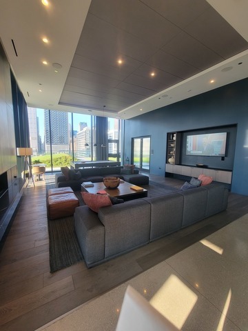 234 West Polk Street, Unit 2610 Chicago, IL 60605 - Photo 17 of 36 a living room with furniture and a flat screen tv