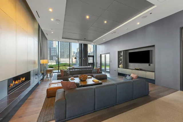 a view of a living room and a floor to ceiling window or kitchen