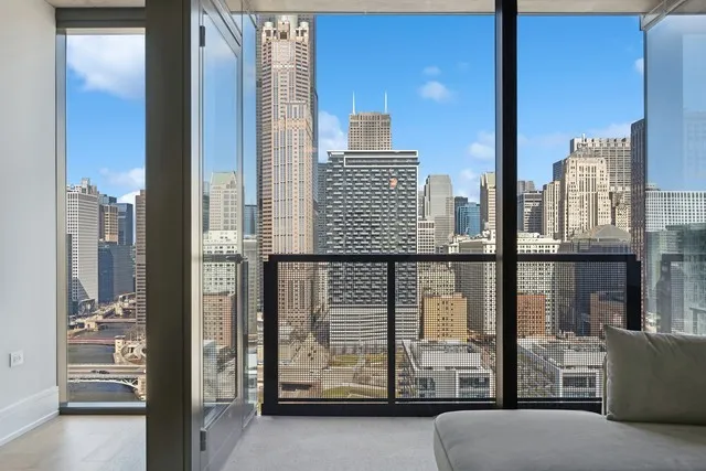 a view of a balcony with furniture