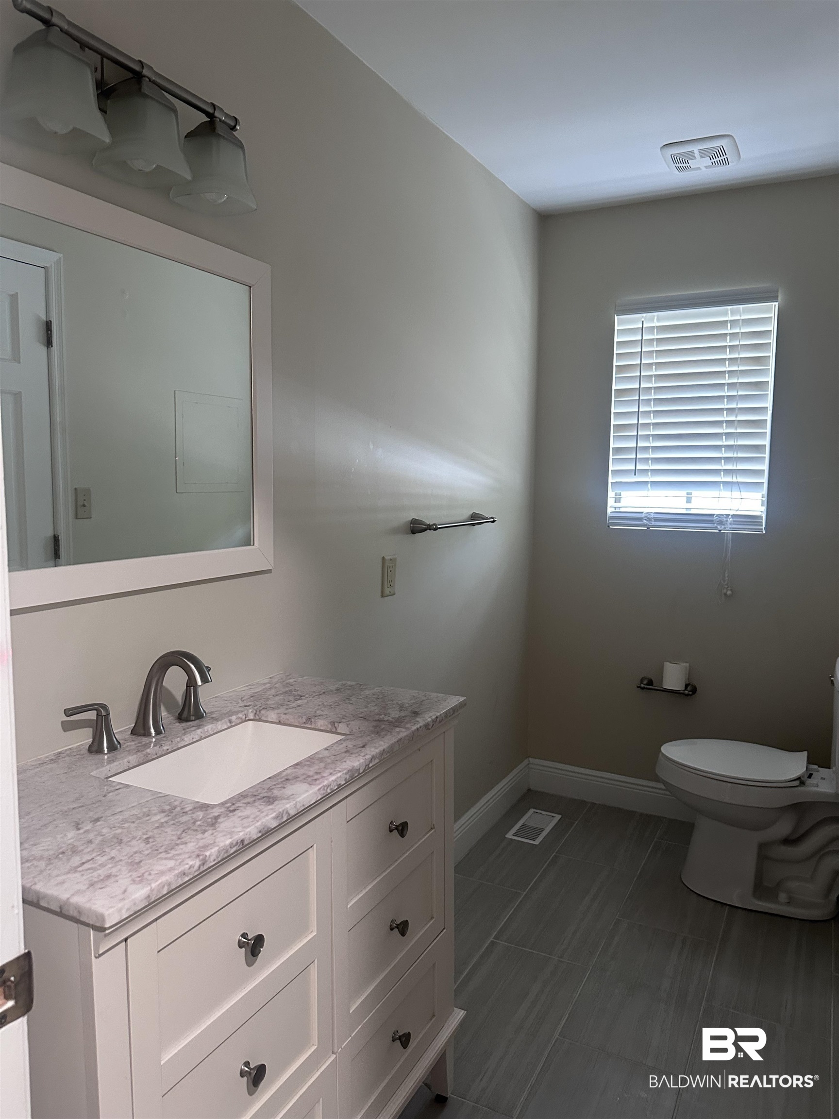 2785 Sowell Road Brewton, AL 36426 - Photo 5 of 24 Half bath featuring vanity and toilet