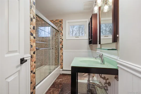 a bathroom with a sink and a bathtub