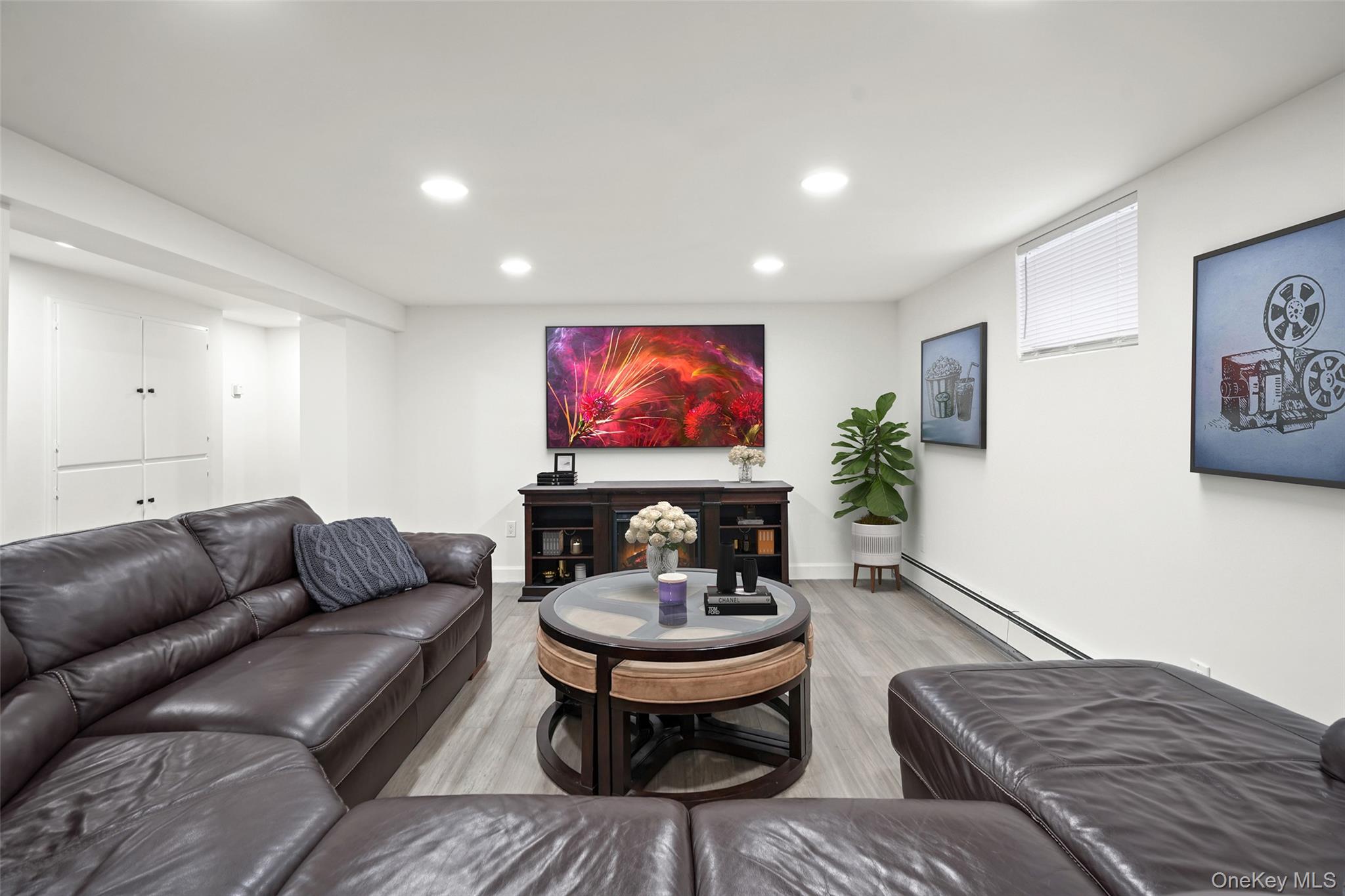 59 Hoags Cross Road Ossining, NY 10562 - Photo 15 of 25 a living room with furniture a rug and a flat screen tv