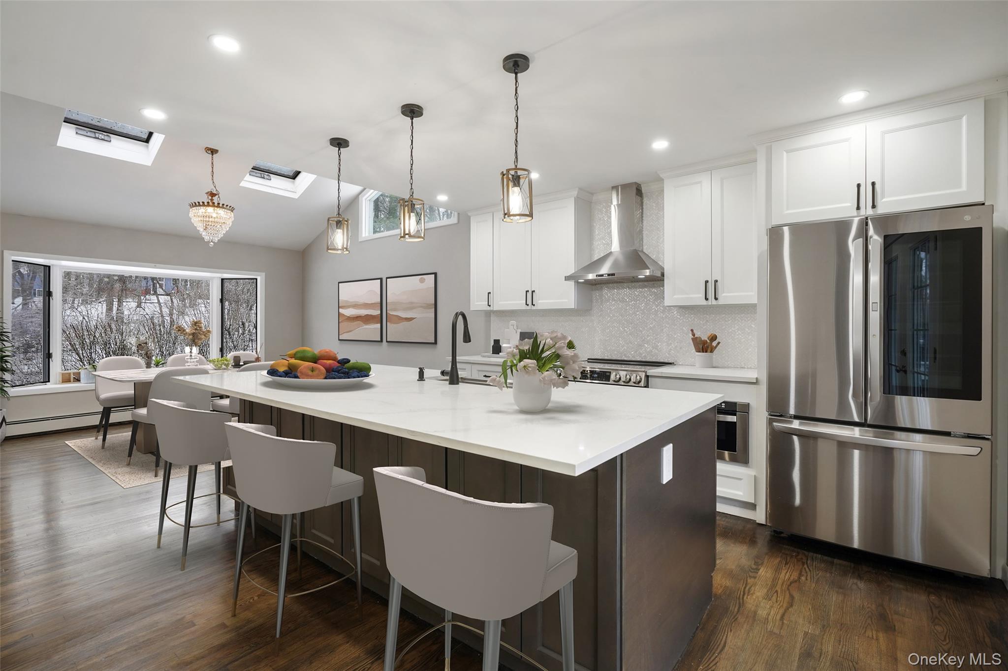 59 Hoags Cross Road Ossining, NY 10562 - Photo 2 of 25 a kitchen with stainless steel appliances a dining table chairs stove and refrigerator