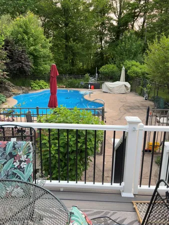 a view of a balcony with chairs