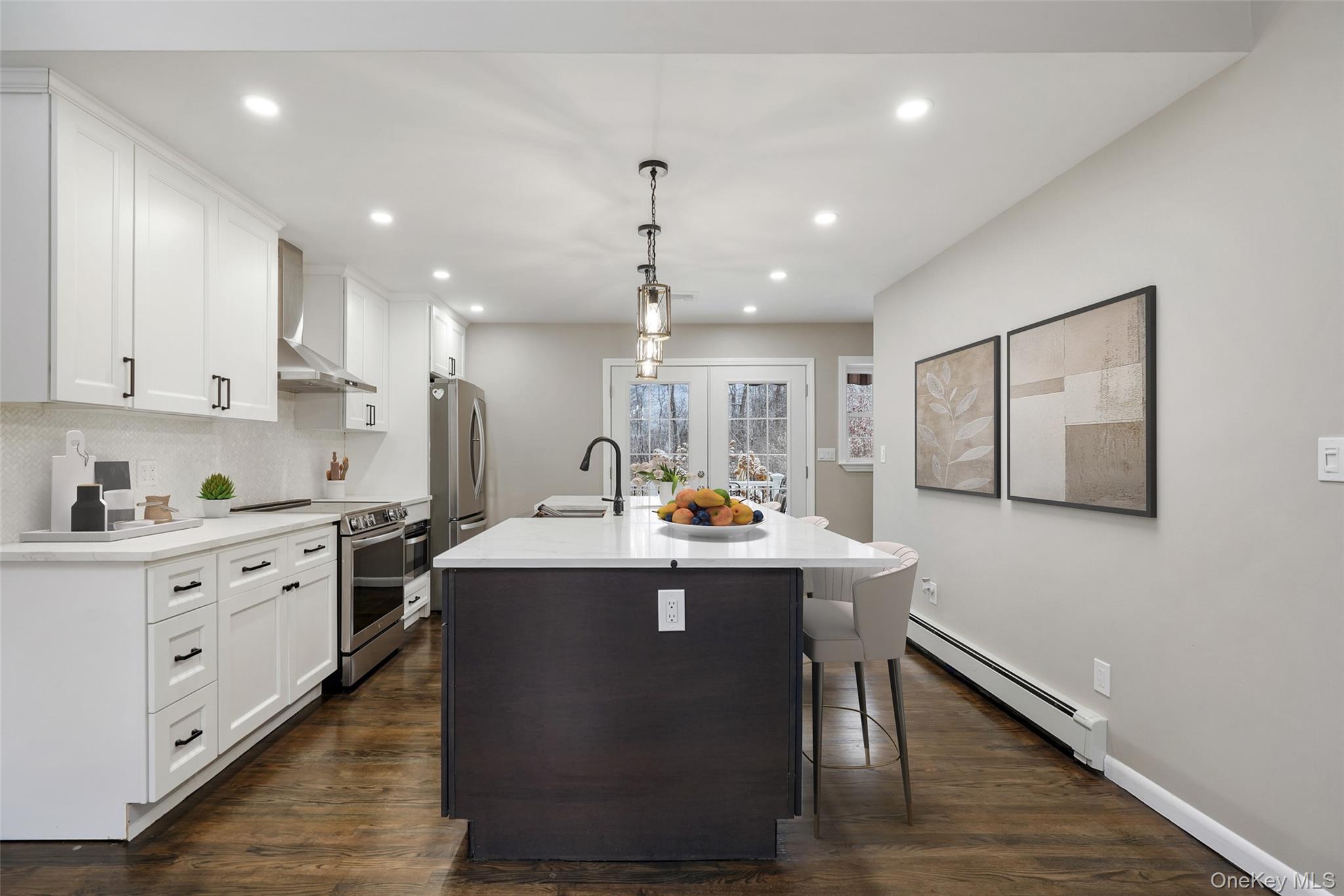 59 Hoags Cross Road Ossining, NY 10562 - Photo 3 of 25 a kitchen with counter top space cabinets and stainless steel appliances