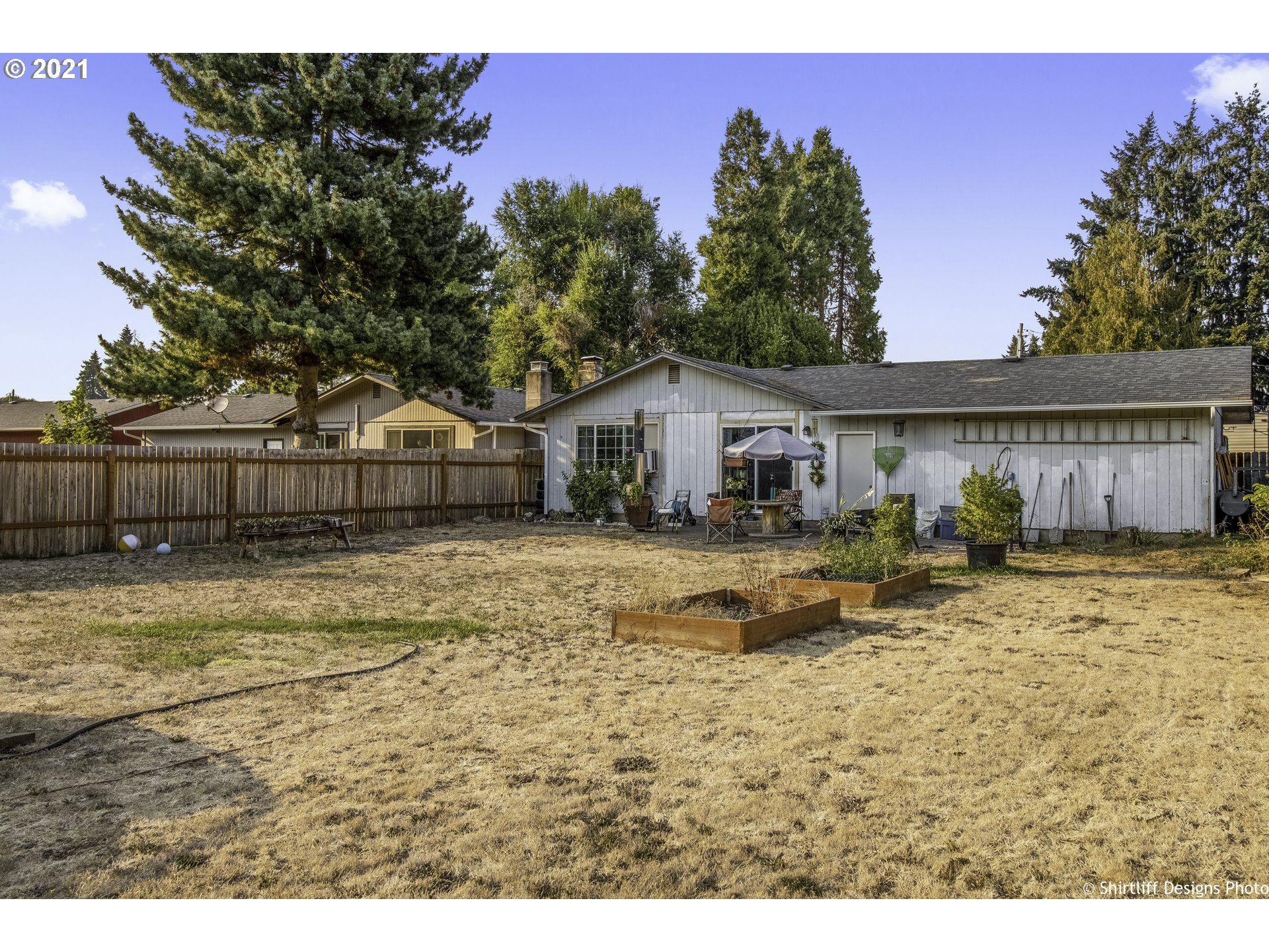 5181 D Street Springfield, OR 97478 - Photo 15 of 16 a view of house with outdoor space and swimming pool