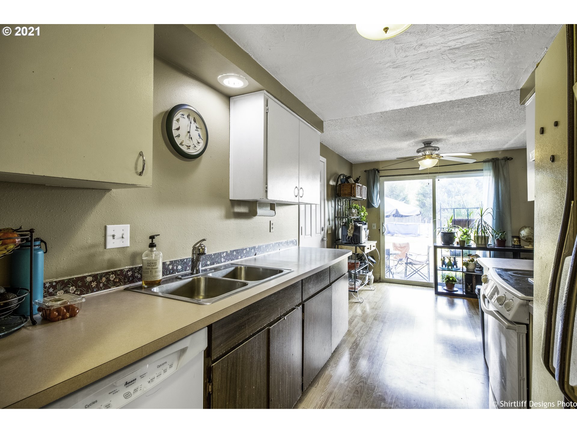 5181 D Street Springfield, OR 97478 - Photo 5 of 16 a kitchen with a sink appliances cabinets and furniture