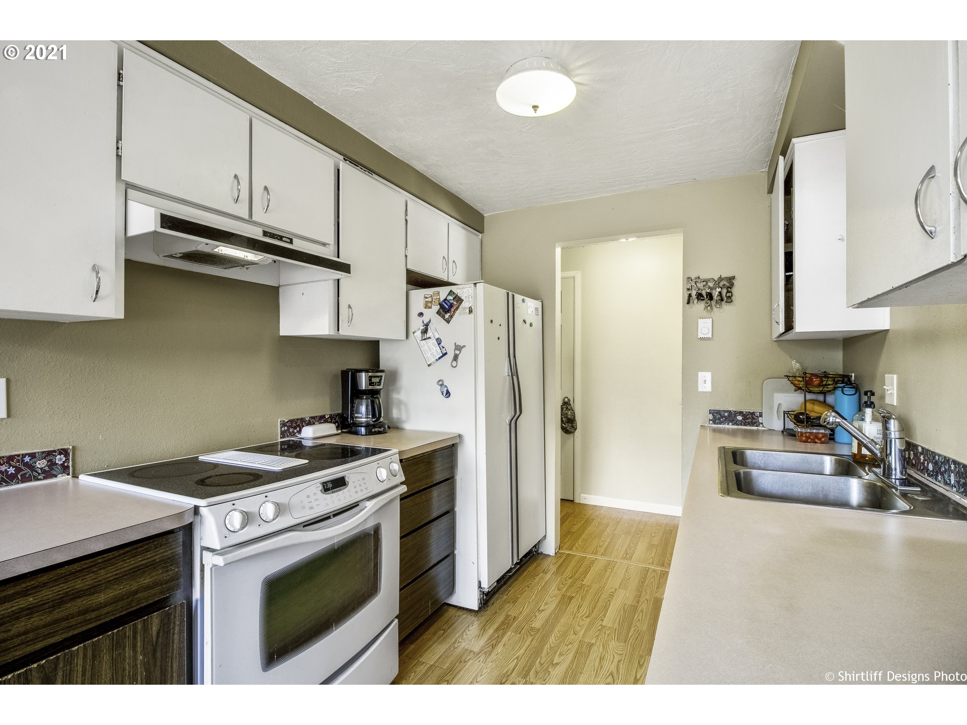 5181 D Street Springfield, OR 97478 - Photo 6 of 16 a kitchen with stainless steel appliances granite countertop a stove a refrigerator and a sink