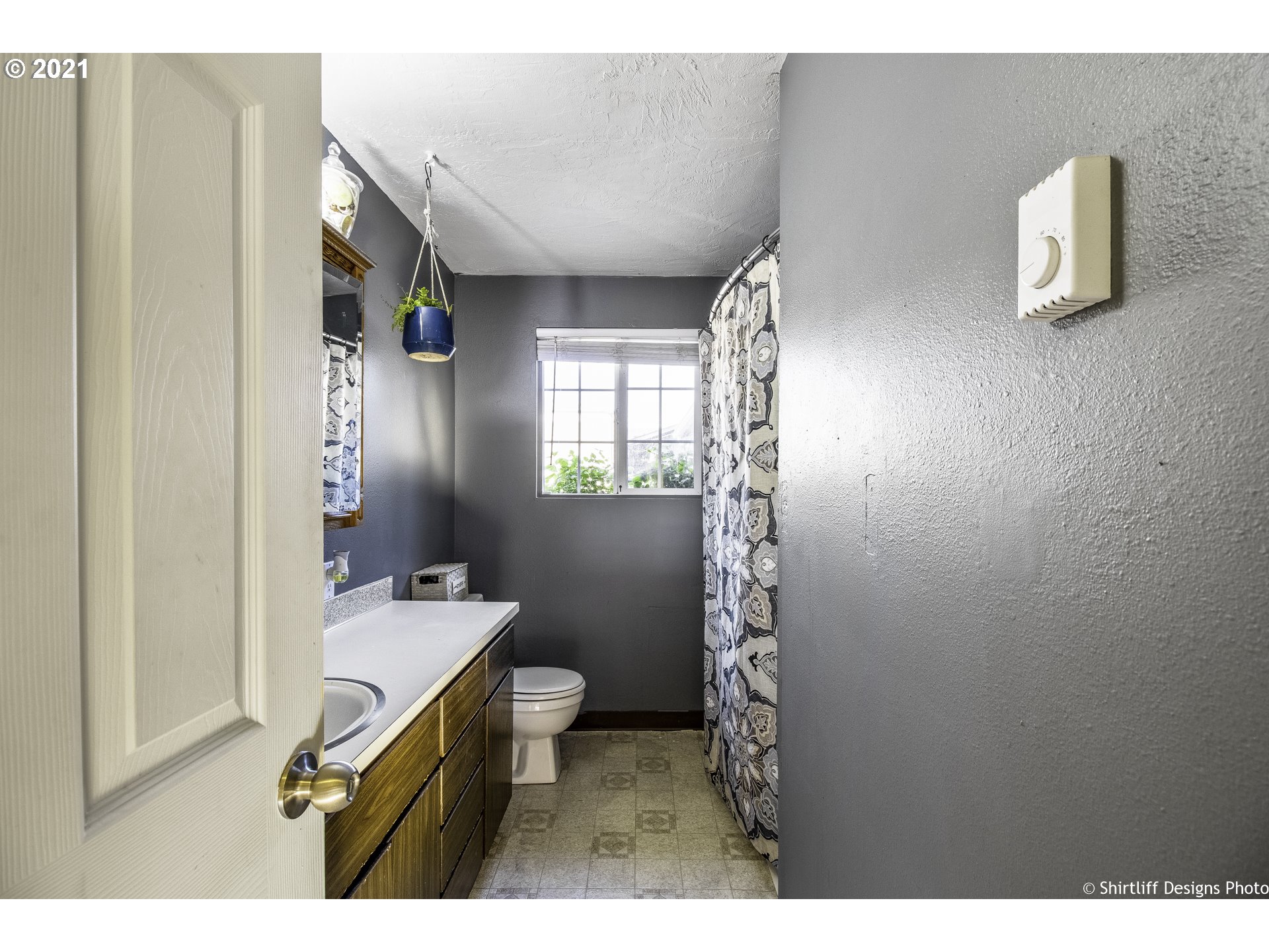 5181 D Street Springfield, OR 97478 - Photo 9 of 16 a bathroom with a sink a toilet and shower