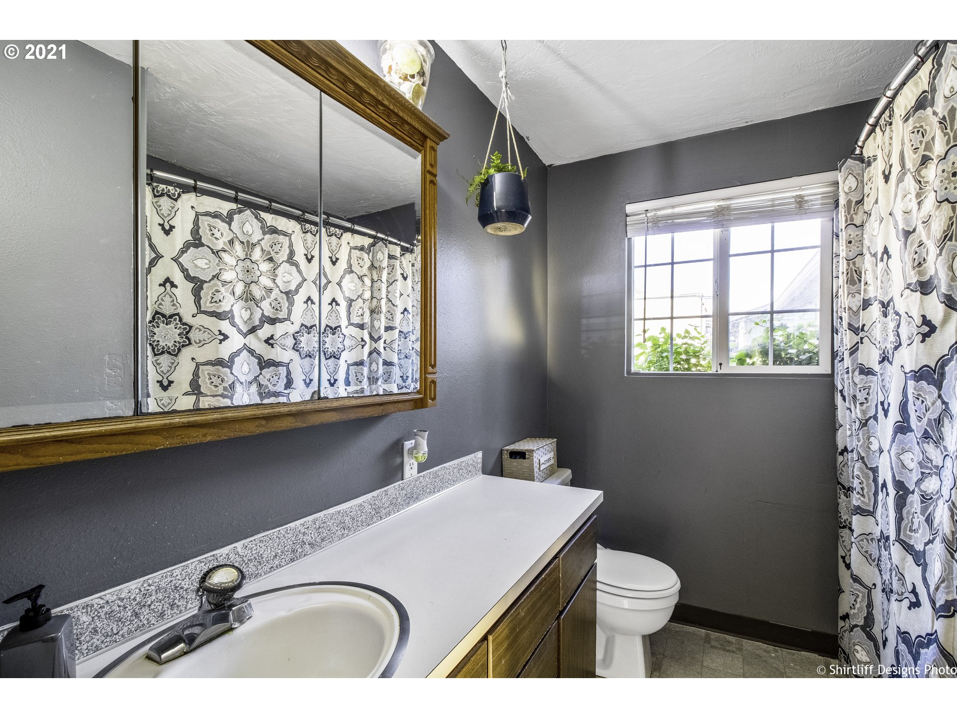 5181 D Street Springfield, OR 97478 - Photo 10 of 16 a bathroom with a sink a toilet and shower