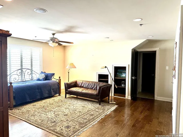 a living room with furniture rug and a table
