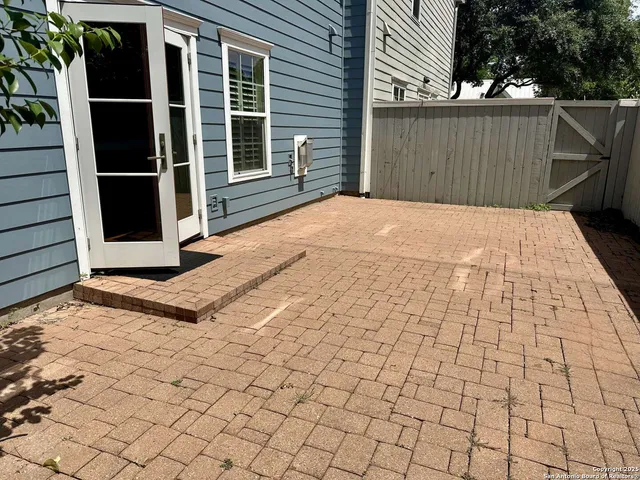 a view of a backyard of the house