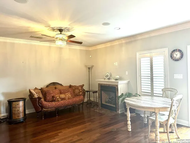 a living room with furniture a window and a table
