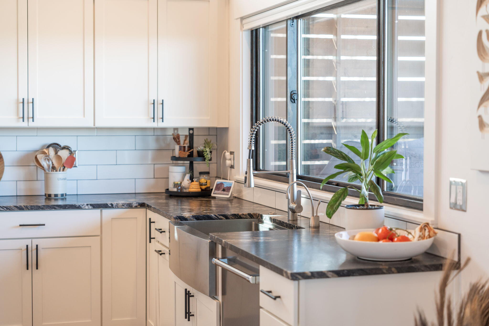 20350 Rock Canyon Road Bend, OR 97703 - Photo 13 of 47 a kitchen with a sink and cabinets