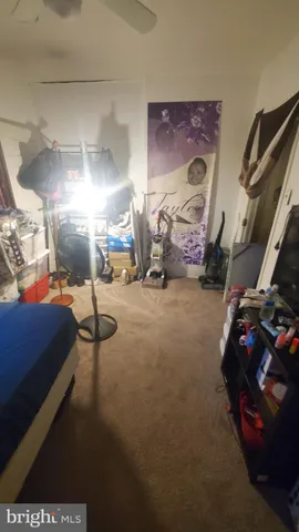 a bedroom with furniture and a lamp