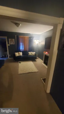 a view of a livingroom with furniture and wooden floor