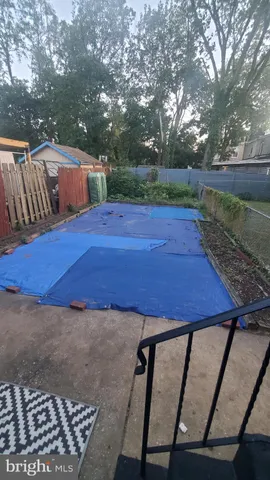 a view of a backyard with trees