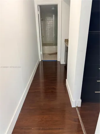 a bathroom with a toilet and a bath tub