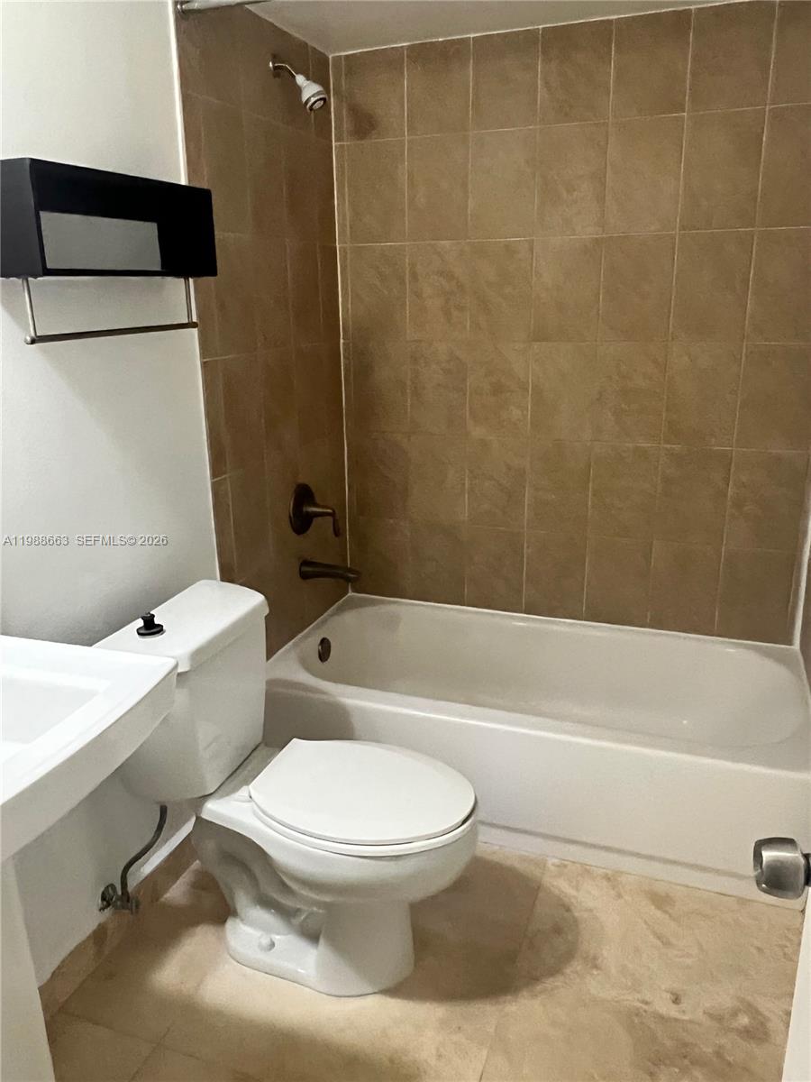 14343 Southwest 98th Terrace Miami, FL 33186 - Photo 15 of 16 a bathroom with a toilet and a bath tub