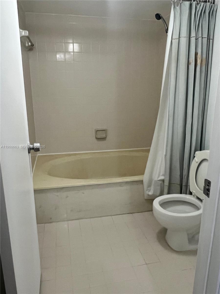 14343 Southwest 98th Terrace Miami, FL 33186 - Photo 16 of 16 a bathroom with a toilet and a shower