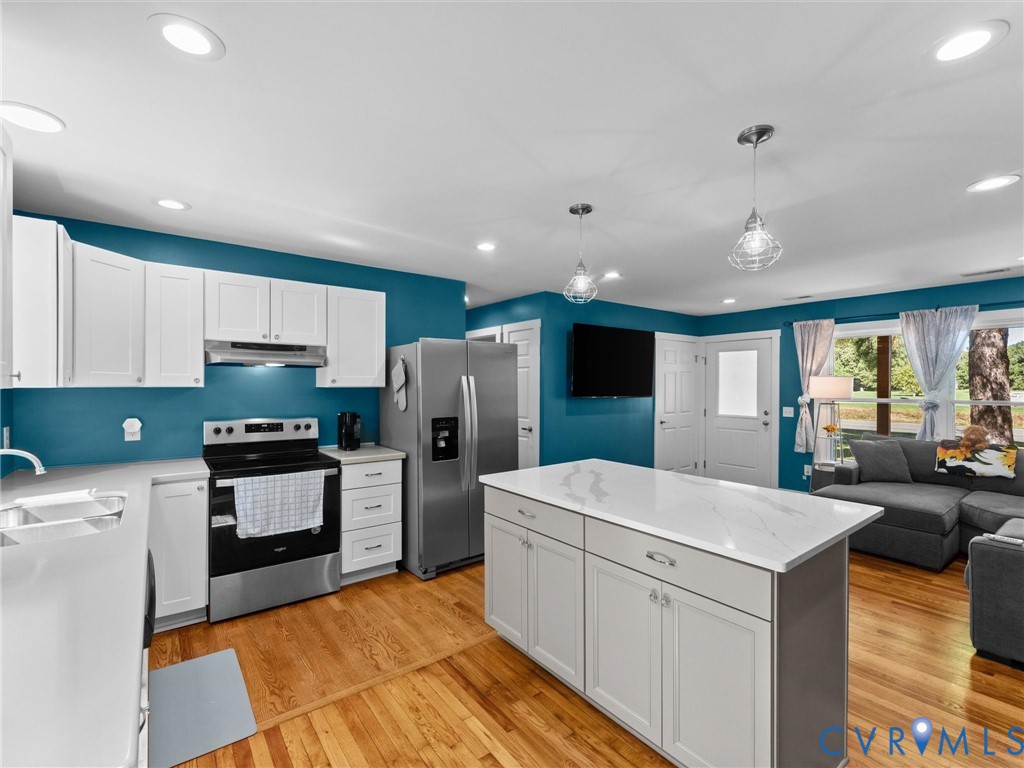 408 Howerton Road Tappahannock, VA 22560 - Photo 18 of 49 Kitchen featuring white cabinetry, stainless steel