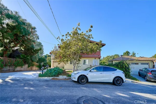 a car parked in front of a house